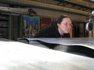 PhD candidate Katja Kim prepares a sheet of metal for an ice collision experiment. Photo: Katja Kim