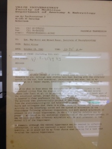 Photo of a framed letter written by Menno Witter to then-master's students May-Britt and Edvard Moser in 1990. The letter is now found outside of Edvard Moser's office. Photo: Nancy Bazilchuk, NTNU