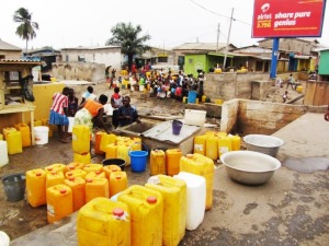 Standing in a queue to collect water in jerrycans is still part of everyday life for many people in Ghana. Photo loaned by CSIR, SINTEF's local partner in Ghana.