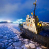 Icebreaker ship trapped in ice tries to leave the bay