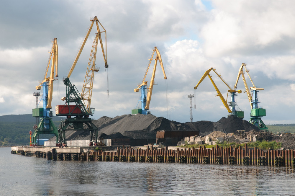 As sea levels rise and winter ice recedes, arctic coastal infrastructure, like this coal loading terminal in Murmansk, face potentially increased erosion problems. Photo: Thinkstock.