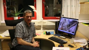 Arne Aalberg in his office at UNIS in Longyearbyen. His computer shows an early mock-up of a design for a snow pressure-plate measuring device. Photo: Nancy Bazilchuk