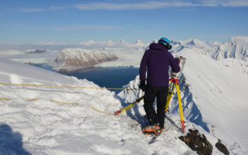 Out in the mountains outisde of Longyearbyen, measuring spatial snow depths. Photo: Private