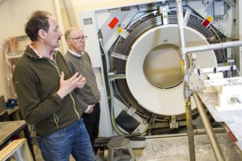 Martin Landrø (left) shown here with his colleague Ole Torsæter, has used a variety of tools to study subsea geology. Here he is shown with an x-ray machine used to examine sandstone from oil reservoirs. Photo: Ole Morten Melgård/NTNU 