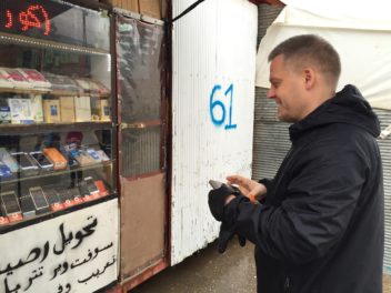 Professor Alf Inge Wang at a mobile phone store in a refugee camp in Turkey. Photo: Liv Marte Nordhaug, Norad