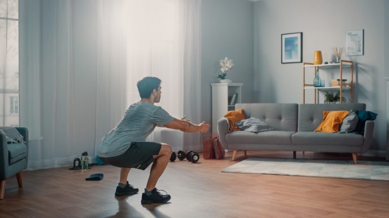A man working out in his livingroom