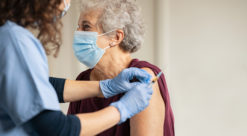 Elderly person getting a vaccine.