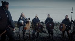 Some viking warriors on a beach by a fjord