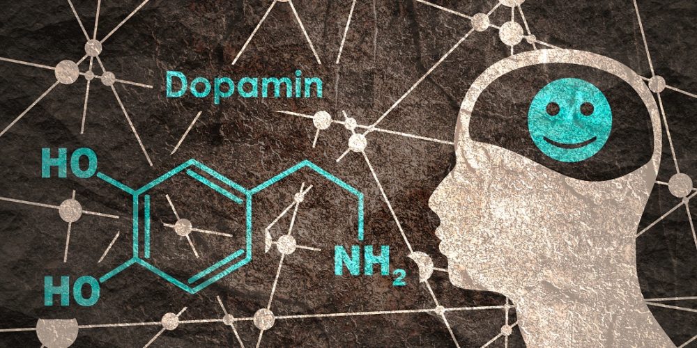 An abstract illustration showing the chemical formula to dopamine and a man with a smiling brain