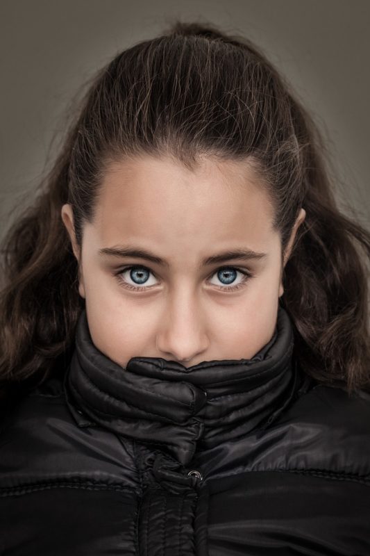 Depression. Illustration photo shows girl with serious facial expression