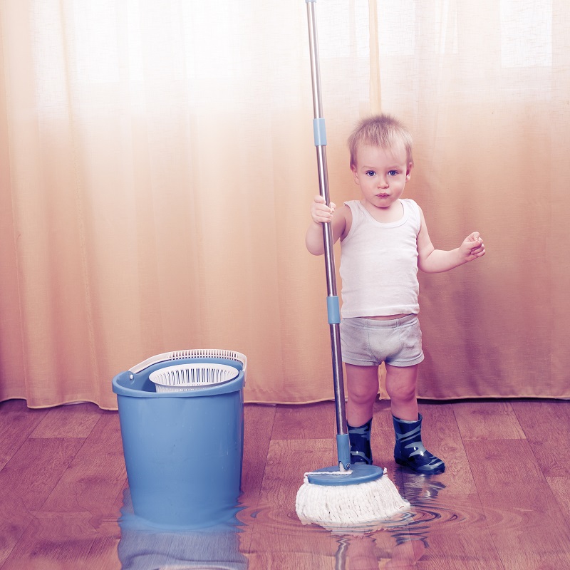 Young,Boy,In,Rubber,Boots,With,Mop.,A,Lot,Of