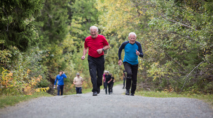 elders exercising on gravel path
