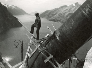 Man standing on a large diameter water 