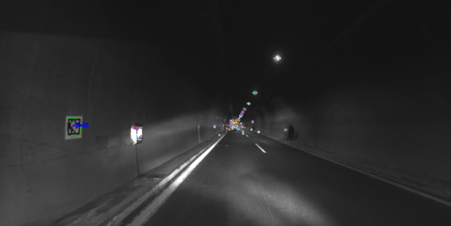 This photo was taken using a camera mounted on a robot vehicle. The robot navigates through the tunnel using a series of markers (shown in colour in the photo). The markers are then processed by a positioning algorithm. Photo: SINTEF