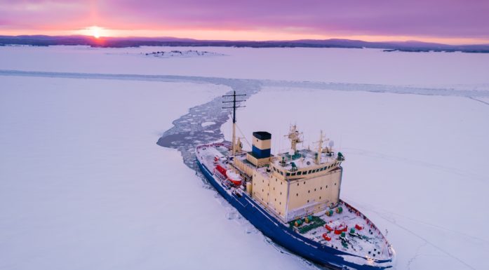fibre-optic Icebreaking Vessel In Arctic at sunset
