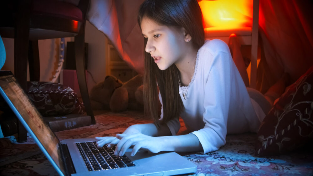 Teenage girl at computer