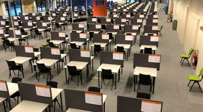 Exam room full of desks in rows