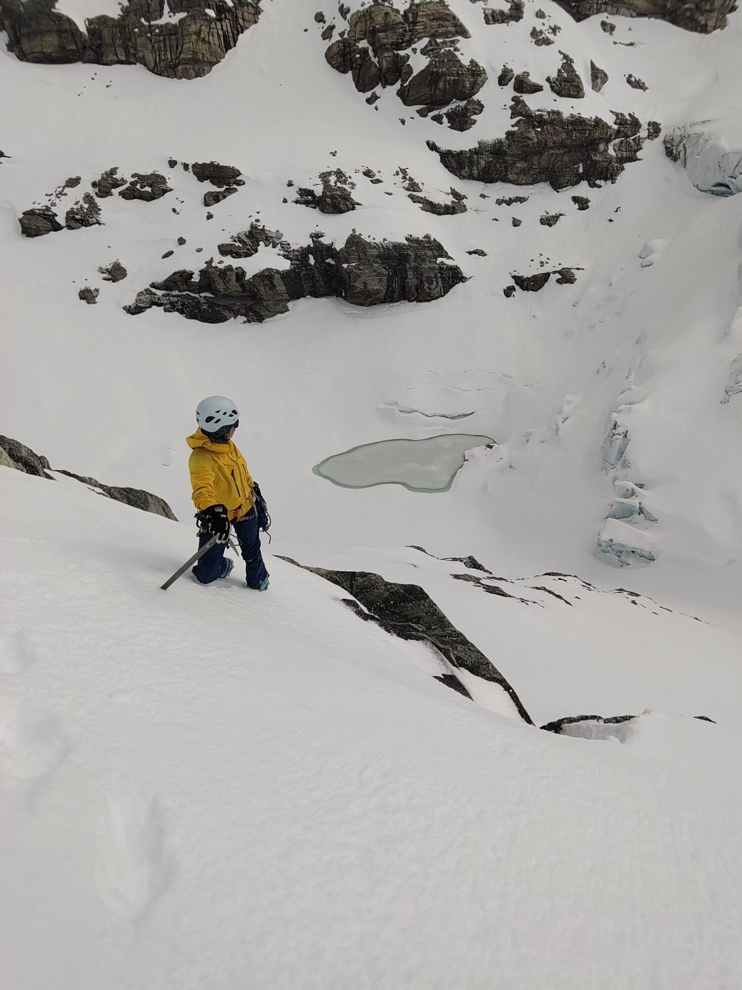 A group of researchers wants to help communities living close to melting glaciers. Photo shows scientists climbing up a glacier in winter.