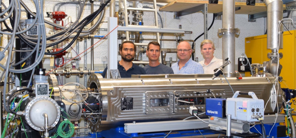 Gas turbines. The photo shows the Hyrope team, four people in a laboratory.