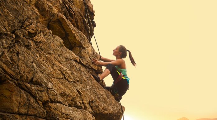 Women. Photo shows a female climber.