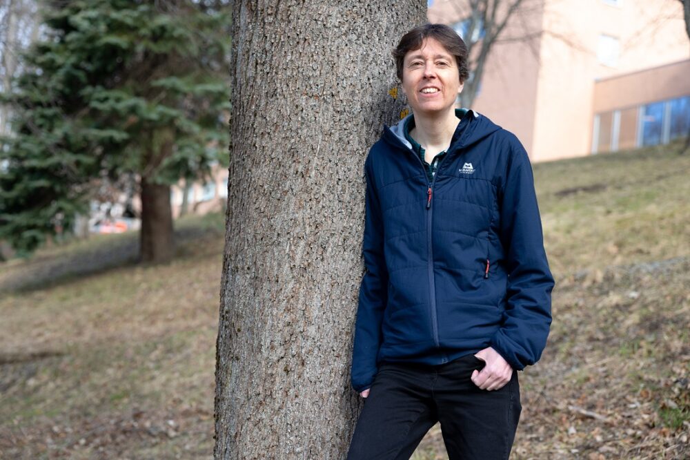 ERC. The picture shows Professor Jane M. Reid by a tree.
