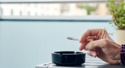 Smokers. Photo shows a hand with a cigarette.