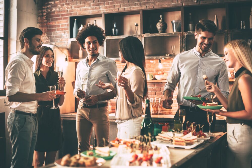 People partying in a kitchen.