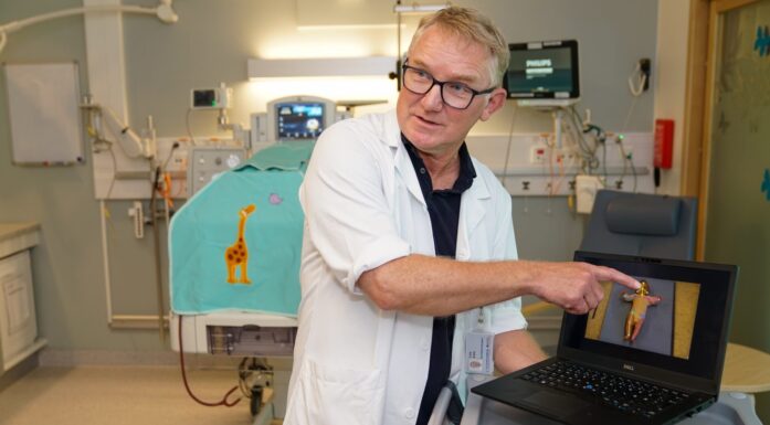 Lars Adde with computer screen showing infant with motion capture dots