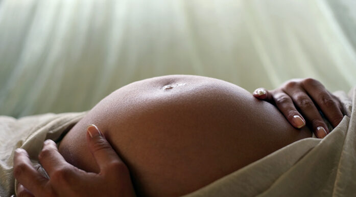 Pregnant woman's belly. Photo.
