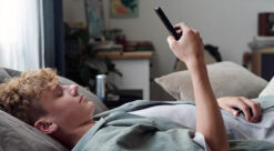 teenager on his phone