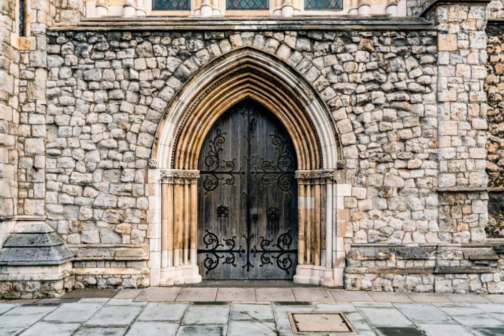 Door of an old Gothic church in London. Photo: istock/ Chunyip Wong