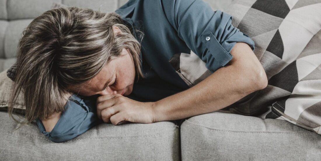 adult woman suffering from headaches at home