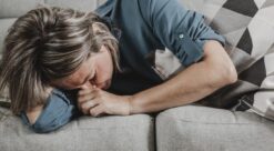 adult woman suffering from headaches at home