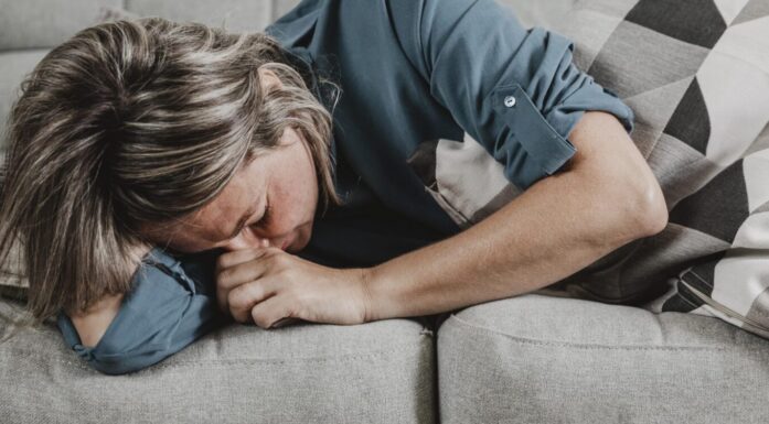 adult woman suffering from headaches at home