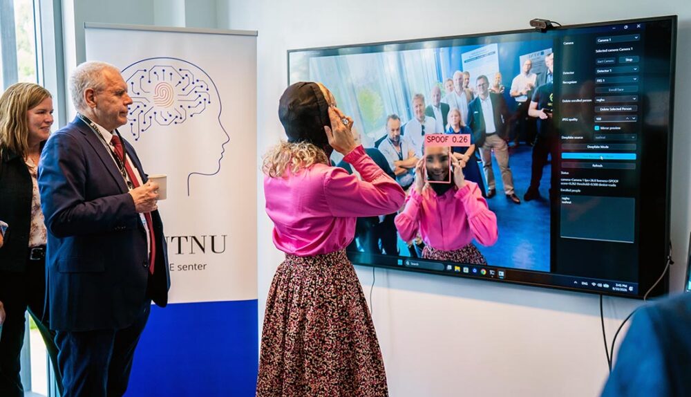 minister trying on a mask in front of screen